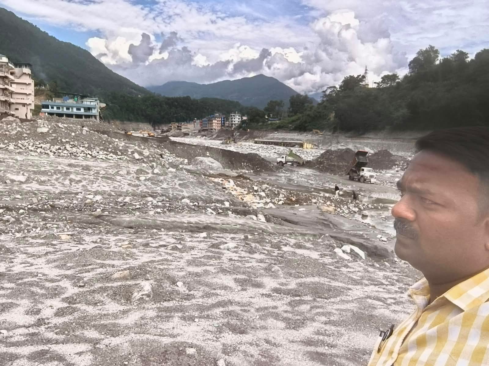 Flood damage Surveying the river bed where the flood swept through
