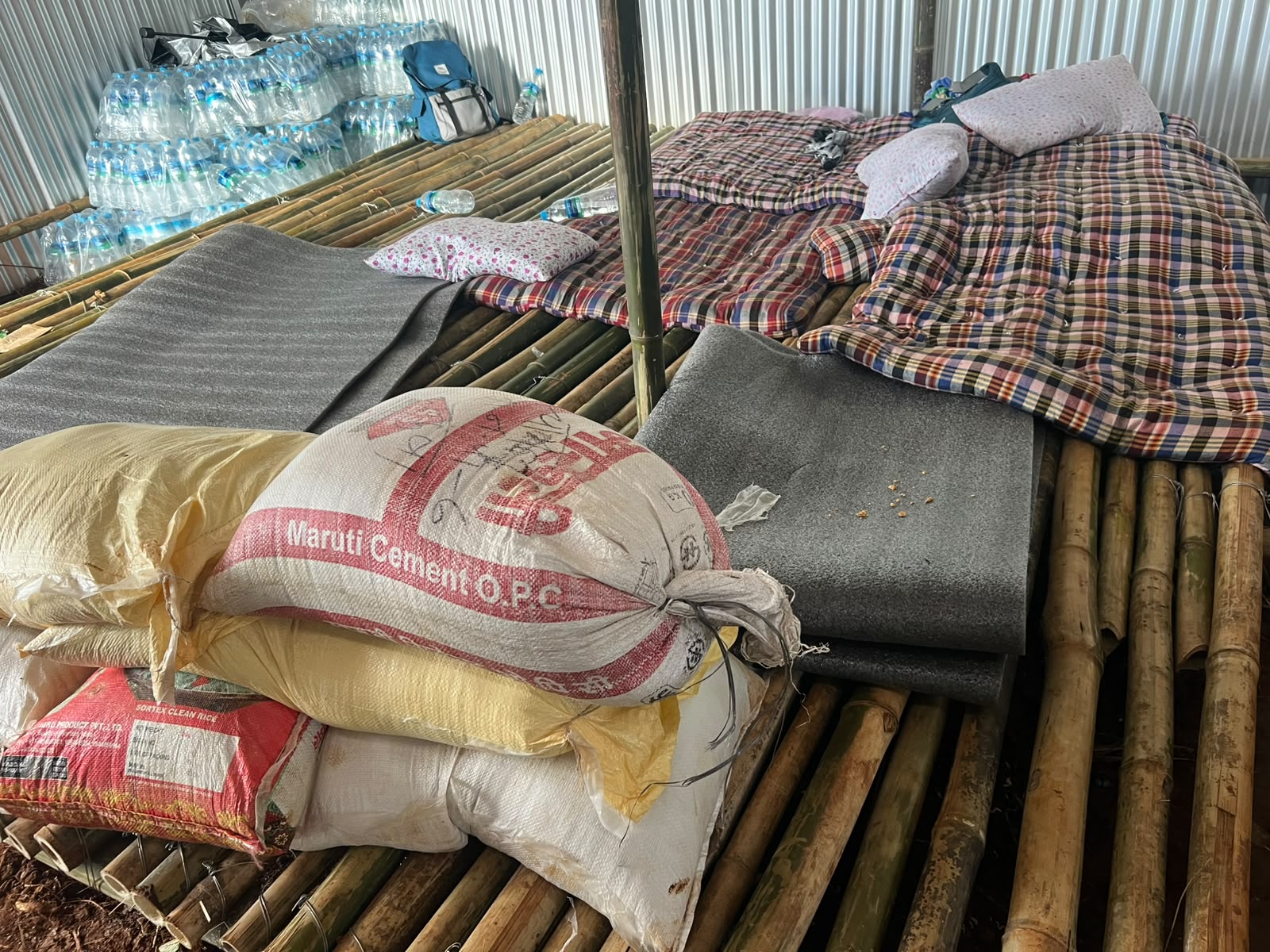 Relief supplies Bedding, rice and drinking water staged for flood-affected families